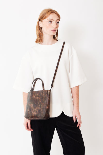 B. May Small Front Pocket Tote being worn by a model