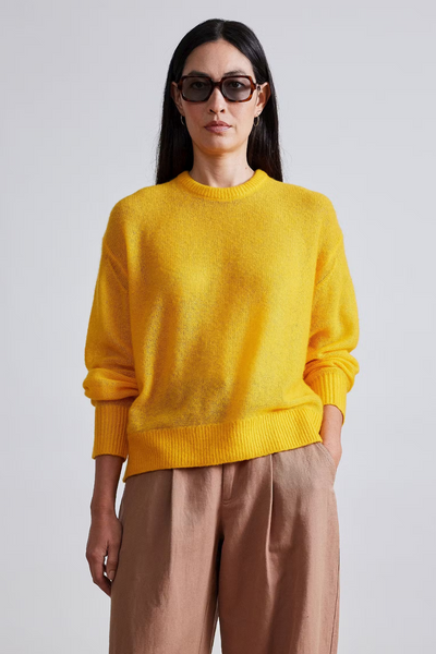 Model wearing Apiece Apart Softest Tissue Weight Sweater front view
