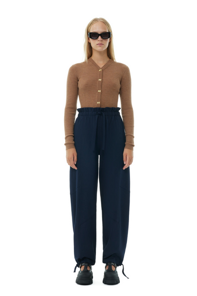 Model wearing Ganni Light Solid Elasticated Waist Pants front view