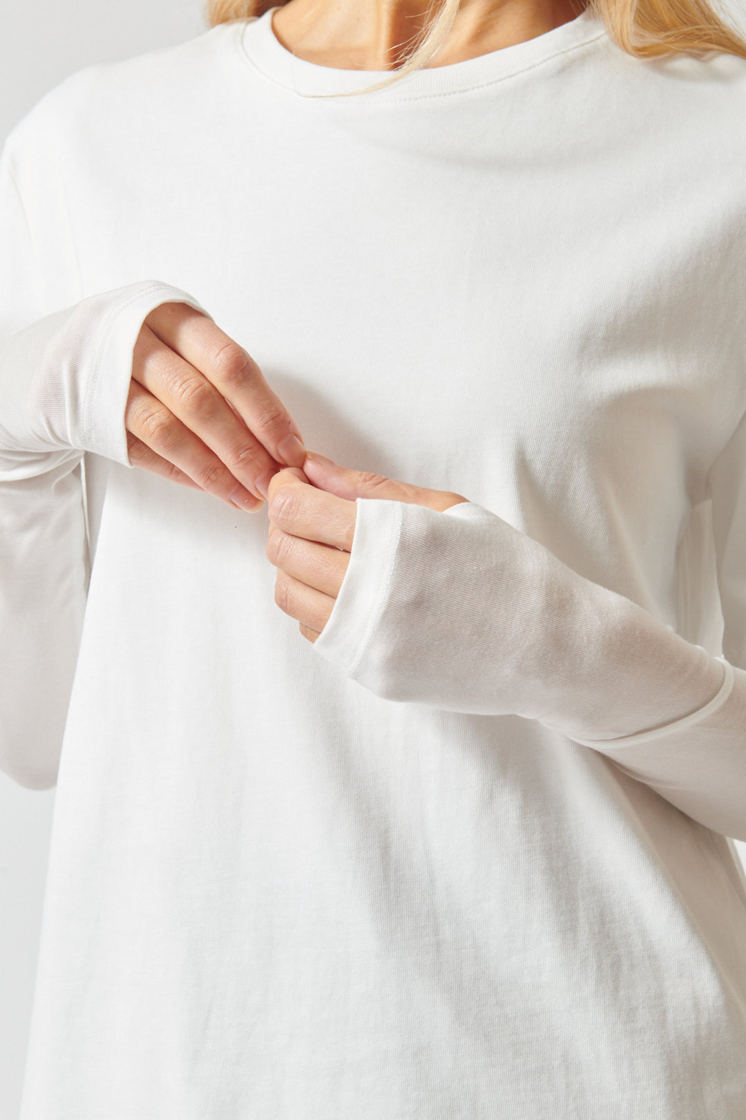 Mari wearing ELEH Long Short Layered Thumb Tee front/detail view