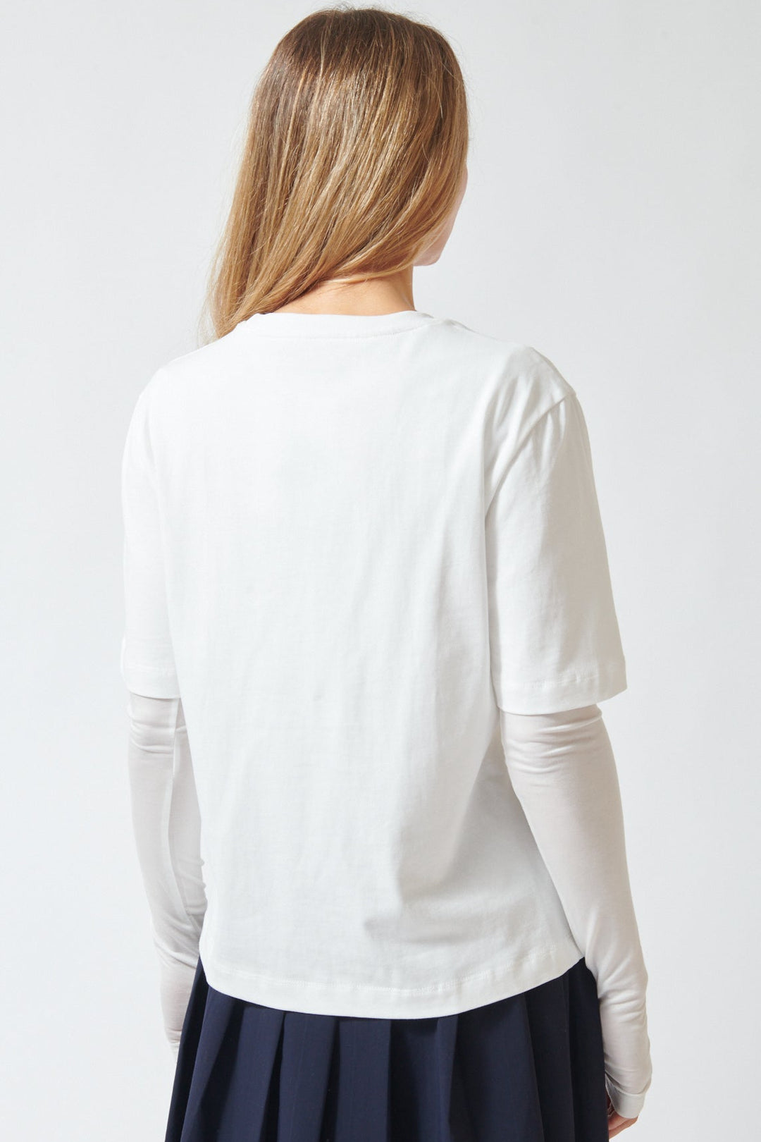 Mari wearing ELEH Long Short Layered Thumb Tee rear view