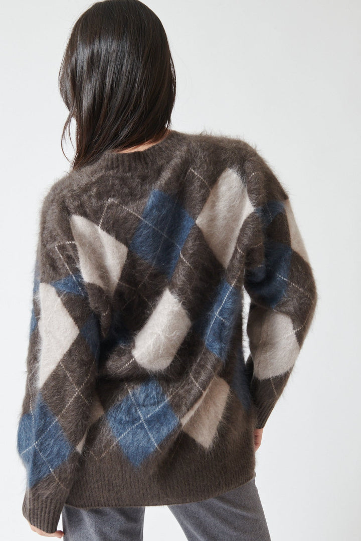 Lilly wearing Lisa Yang Elaria Cardigan rear view