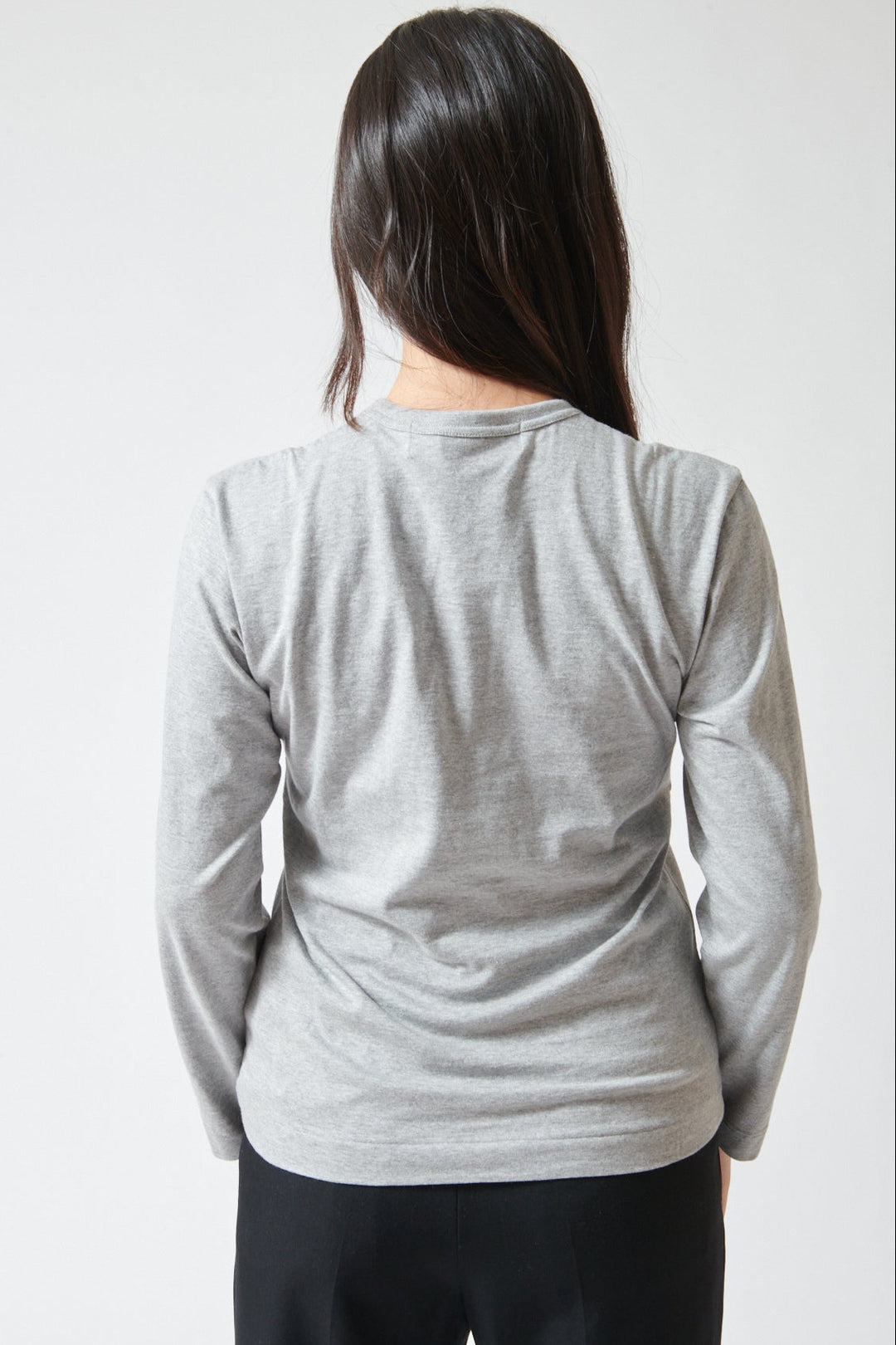 Lilly wearing Comme des Garçons PLAY Duo Pair Heart Logo Print Long Sleeve T-Shirt rear view