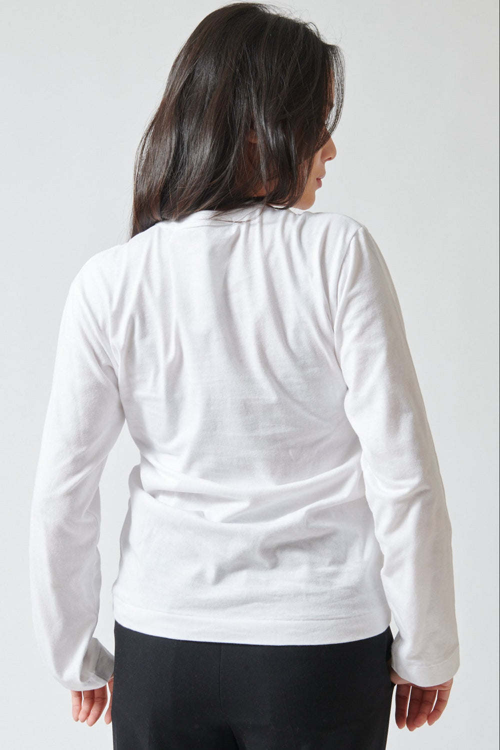 Lilly wearing Comme des Garçons PLAY Duo Pair Heart Logo Print Long Sleeve T-Shirt rear view