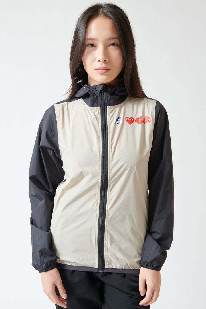 Lilly wearing Comme des Garçons PLAY K-Way Full Zip Red Emblem Jacket front view