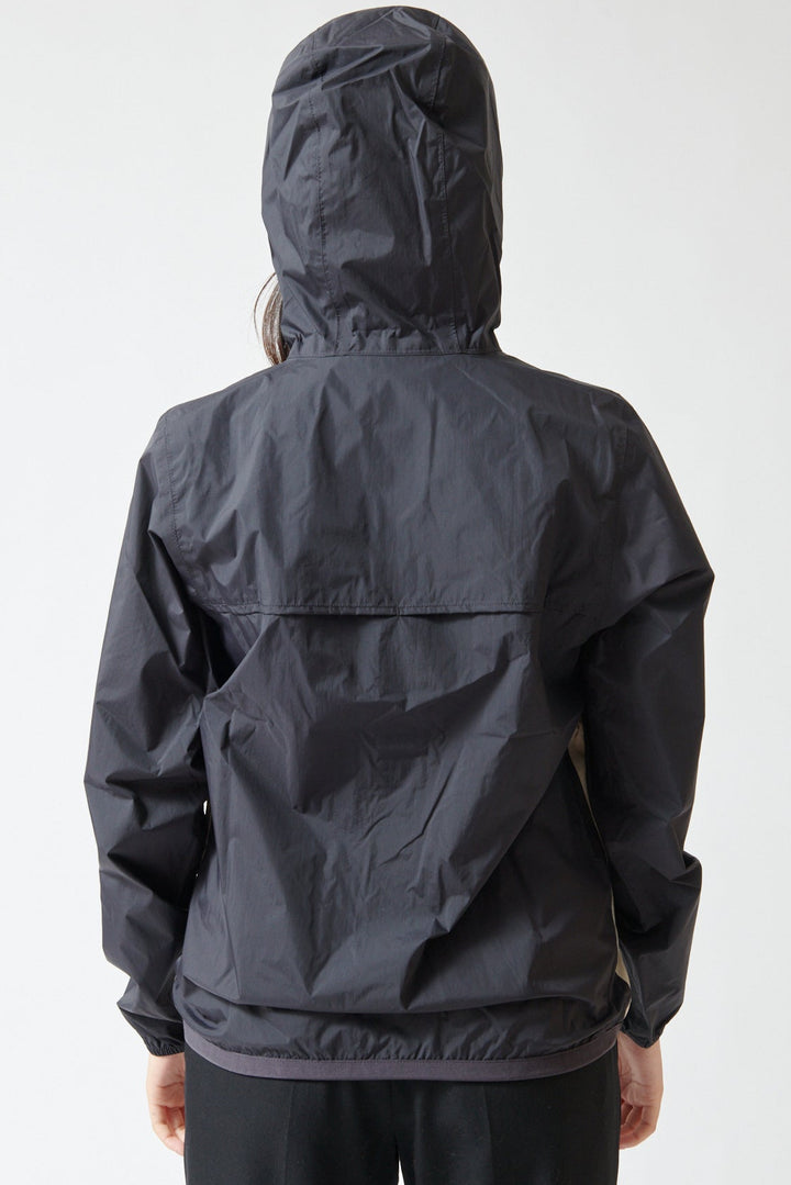 Lilly wearing Comme des Garçons PLAY K-Way Full Zip Red Emblem Jacket rear view