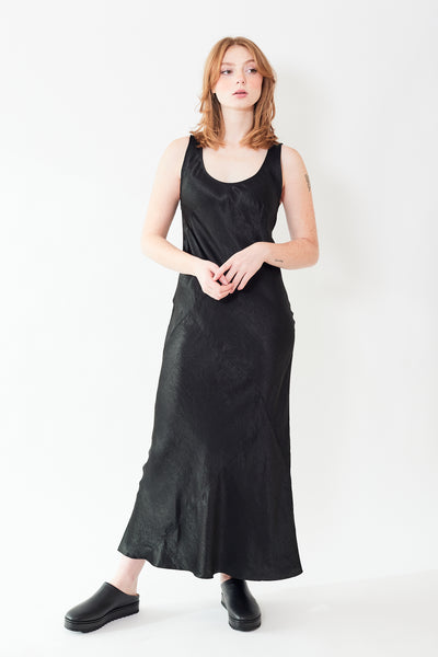 Waverly wearing Lauren Manoogian Luster Bias Dress black front view