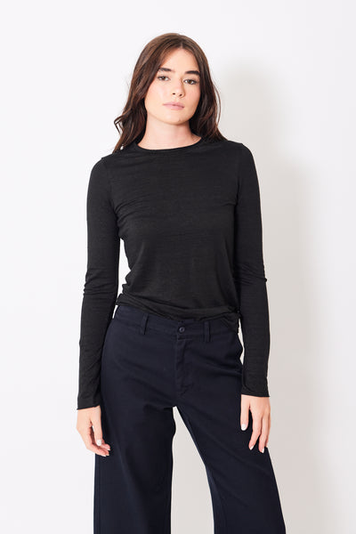 Front view of model wearing long sleeve black t-shirt