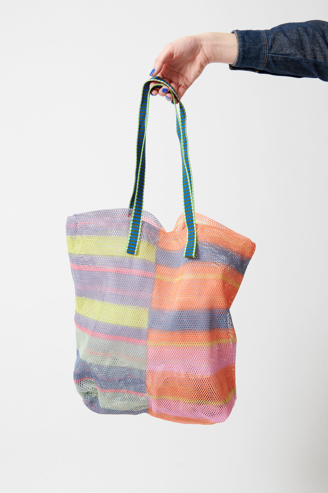 Model wearing Épice Large Stripe Mesh Tote front view
