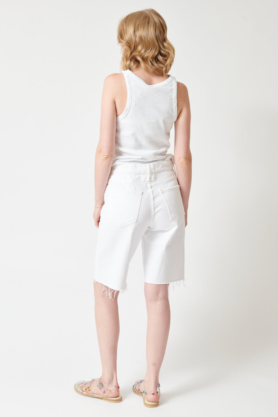 Madi wearing Mother Denim The Maven Bermuda Fray rear view
