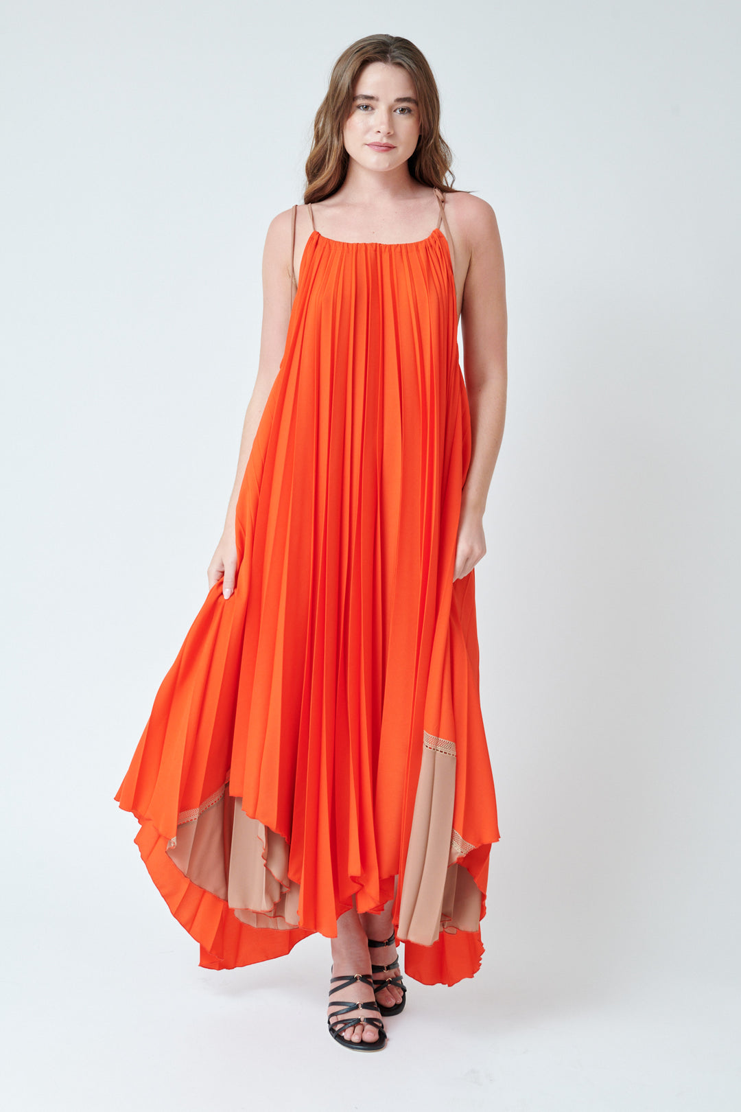 Julia wearing SFIZIO Wide Scalloped Hem Flowing Pleat Dress front view