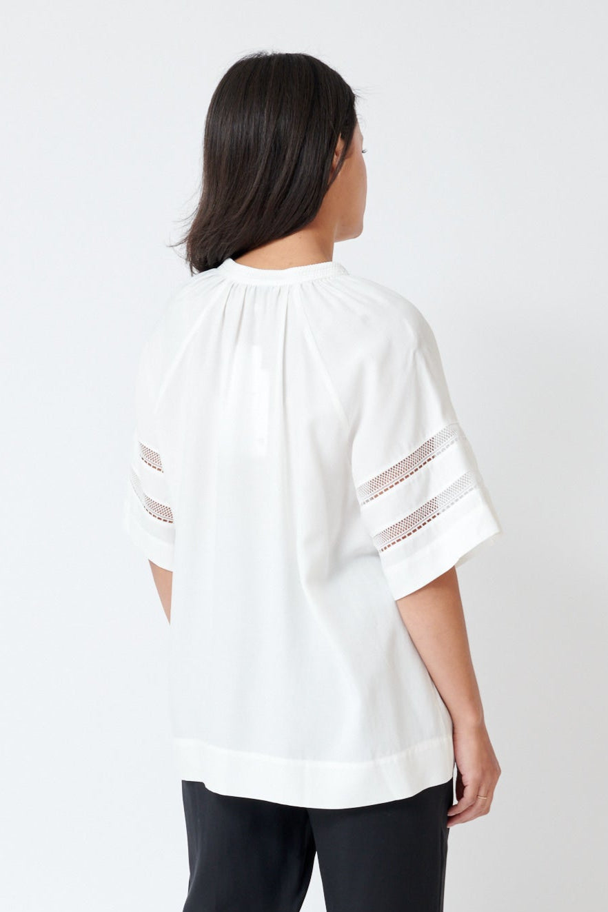 Amanda wearing SFIZIO Tea Cloth Tunic Top rear view