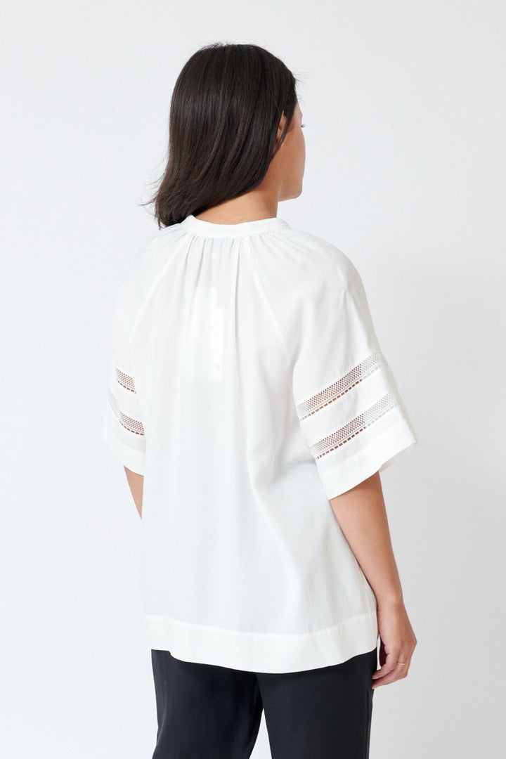 Amanda wearing SFIZIO Tea Cloth Tunic Top rear view