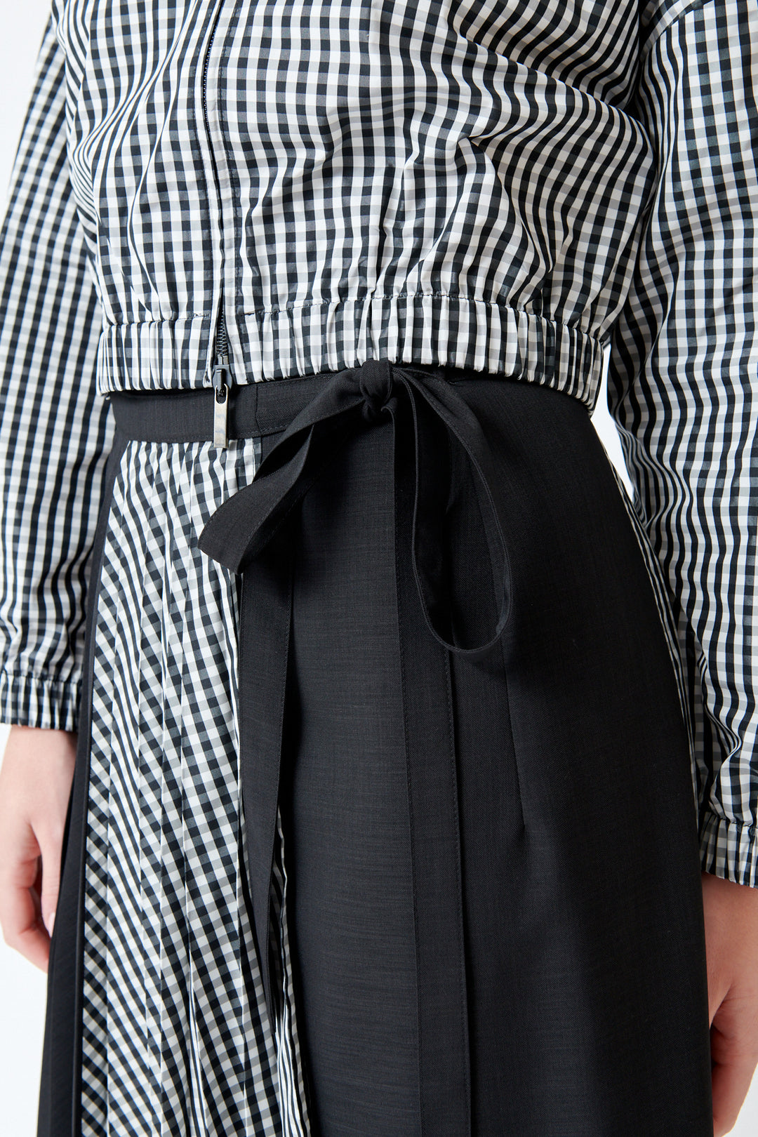 Julia wearing SFIZIO Scalloped Hem Pleated Wrap Skirt front/detail view
