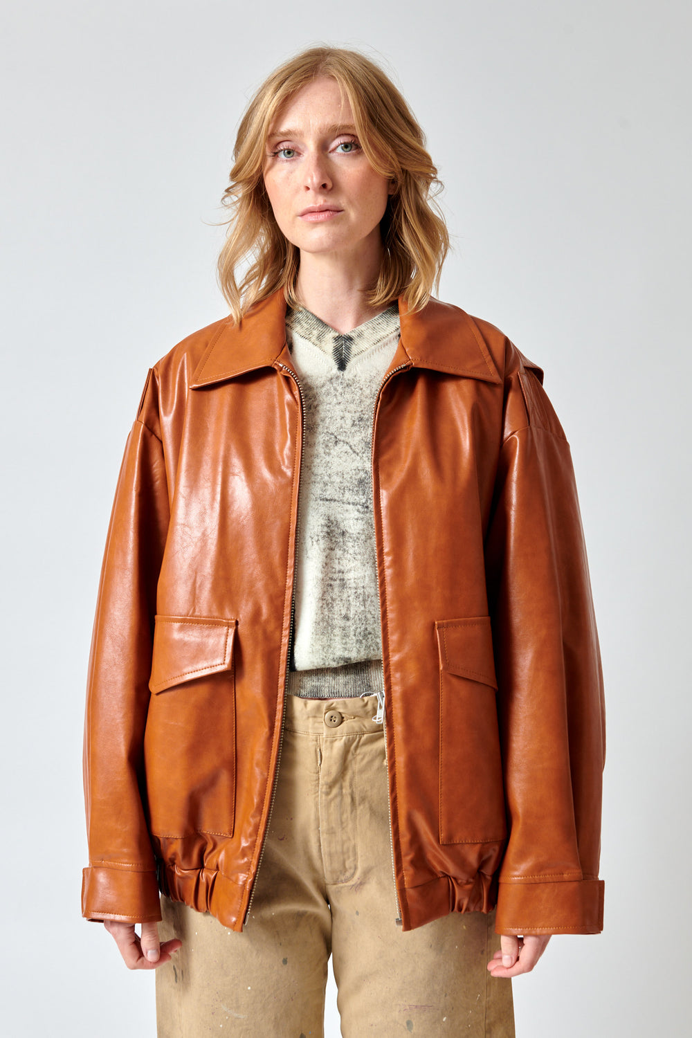 Madi wearing MM6 Maison Margiela Faux Leather Oversized Zip Jacket front view