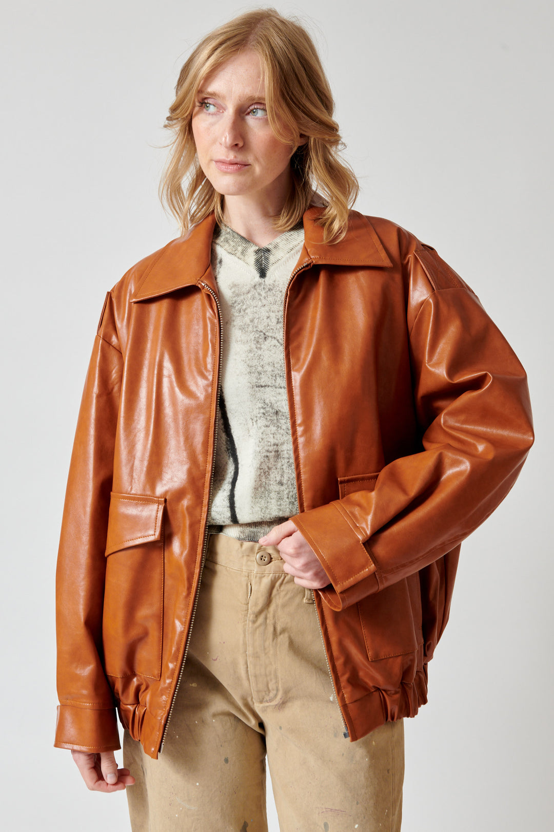 Madi wearing MM6 Maison Margiela Faux Leather Oversized Zip Jacket front view