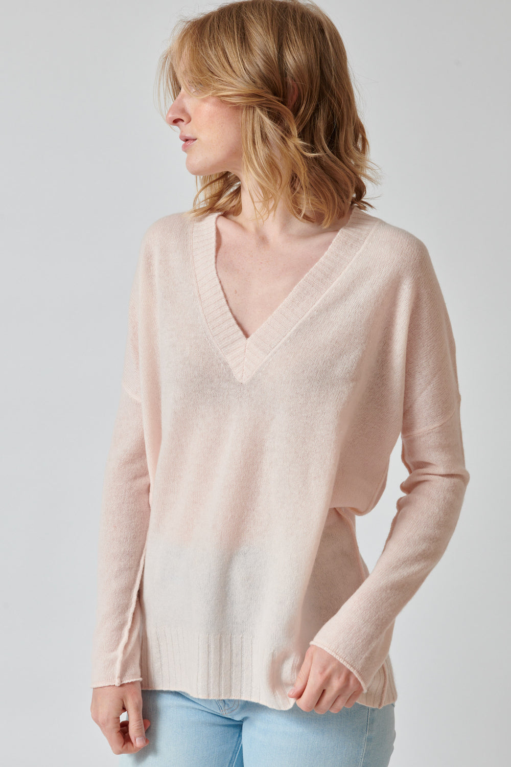 Madi wearing KUJTEN Elena Deep V Sweater front view