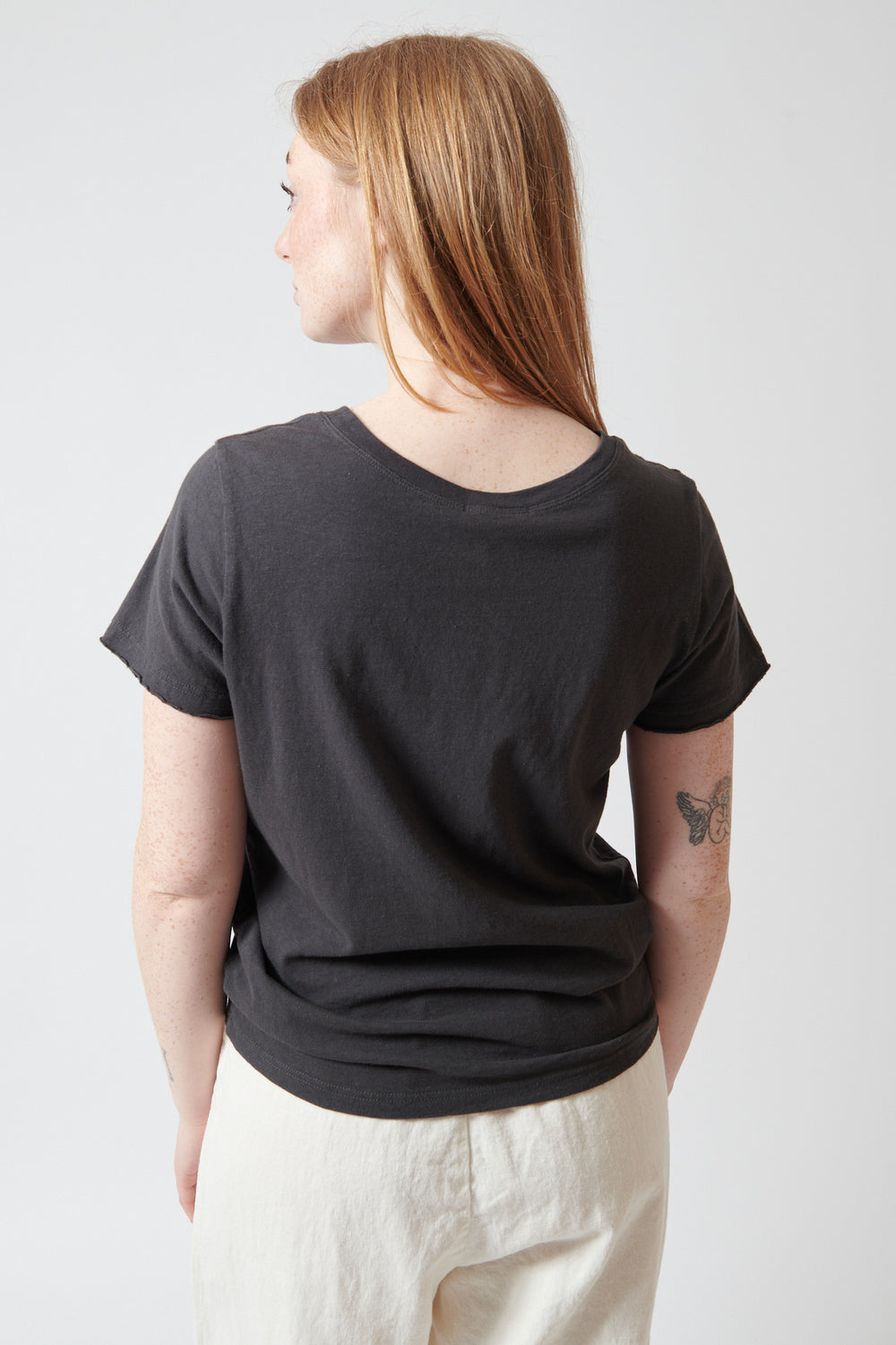 Waverly wearing Pas de Calais Recycled Cotton Crew Neck T Shirt rear view