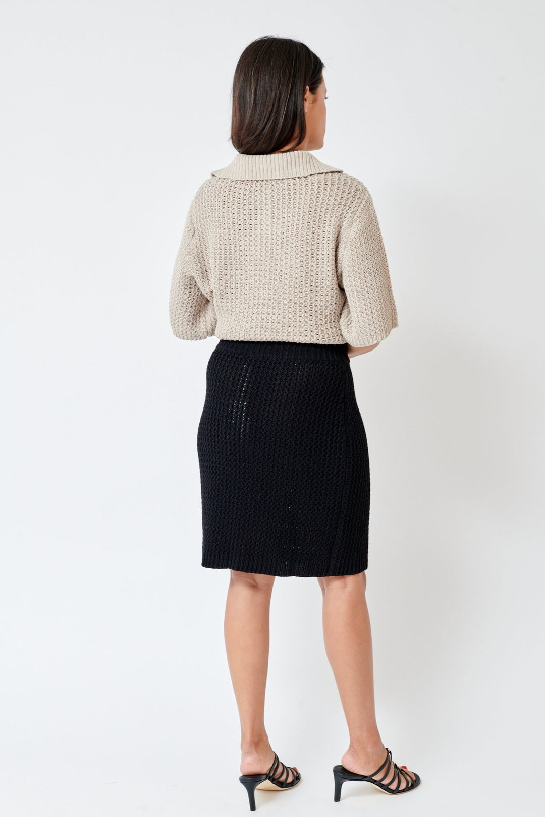 Amanda wearing Lauren Manoogian Rack Mini Skirt rear view