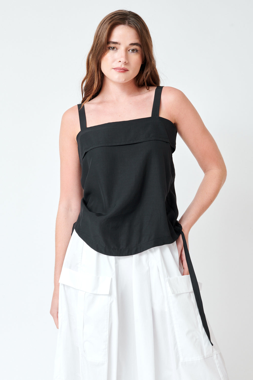 Julia wearing Tela Larry Top front view