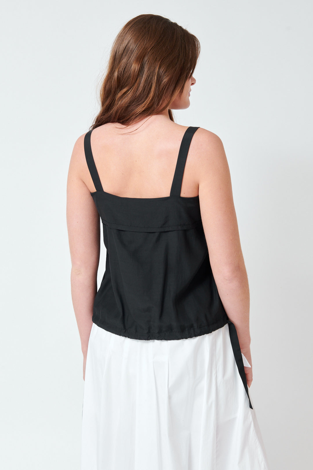 Julia wearing Tela Larry Top rear view