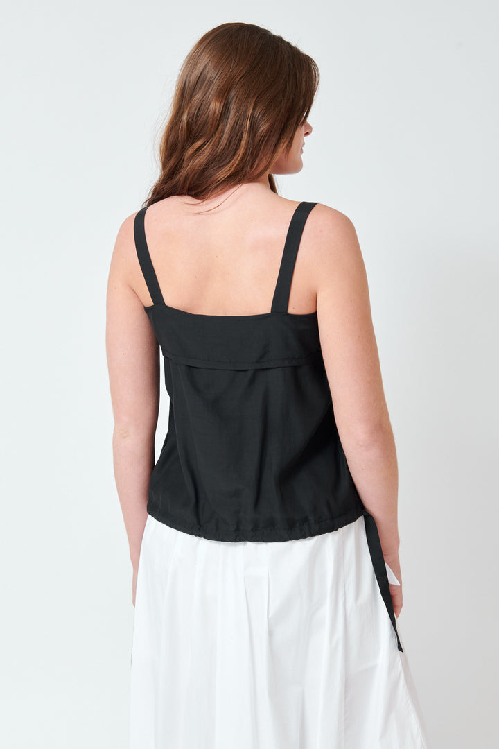 Julia wearing Tela Larry Top rear view