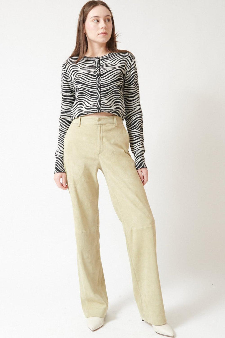 Angela wearing SPRWMN Suede Baggy Lowrise Trousers front view