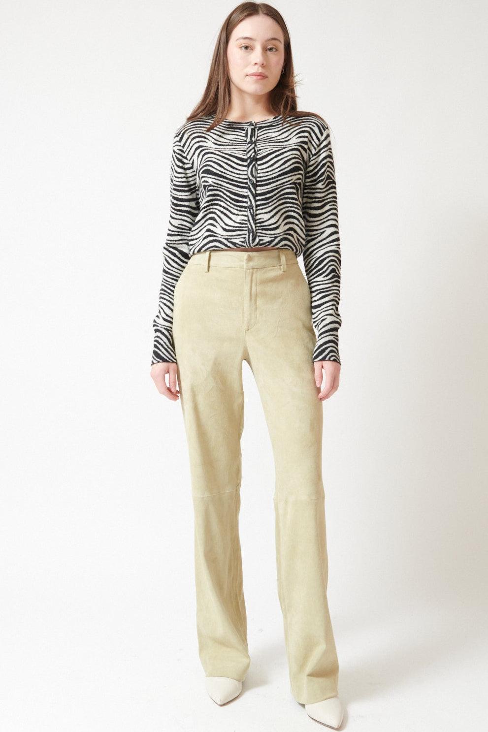 Angela wearing SPRWMN Suede Baggy Lowrise Trousers front view