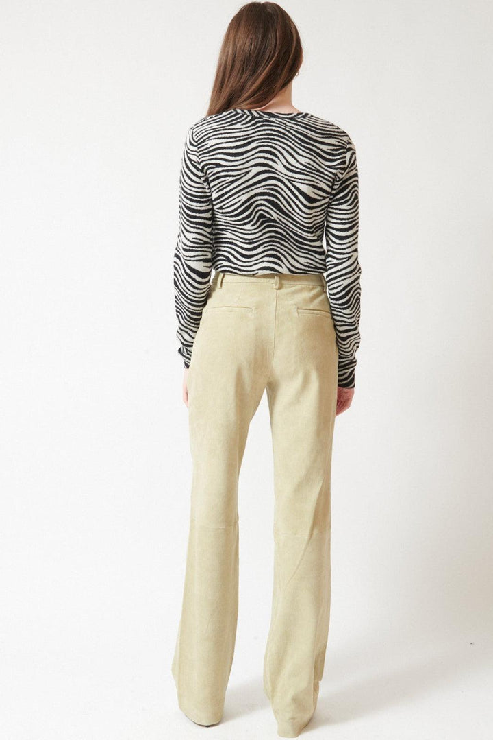 Angela wearing SPRWMN Suede Baggy Lowrise Trousers rear view