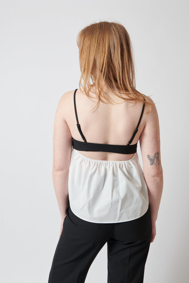 Waverly wearing The Garment Noah Tank Top rear view