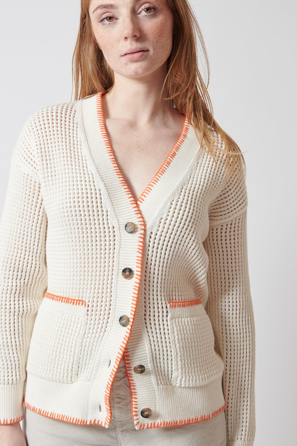 Waverly wearing White + Warren Organic Cotton Blanket Trim Cardigan front view