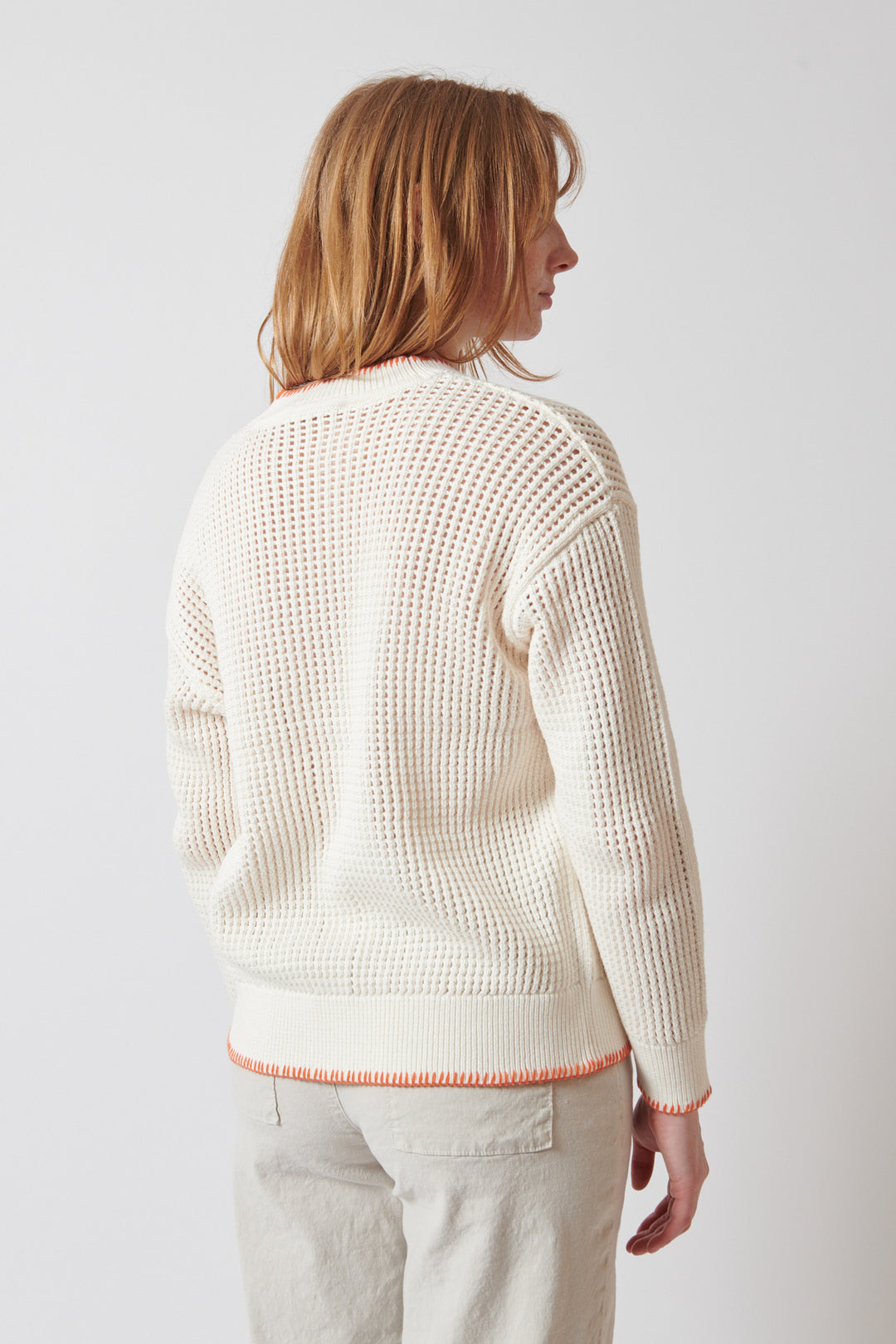Waverly wearing White + Warren Organic Cotton Blanket Trim Cardigan rear view
