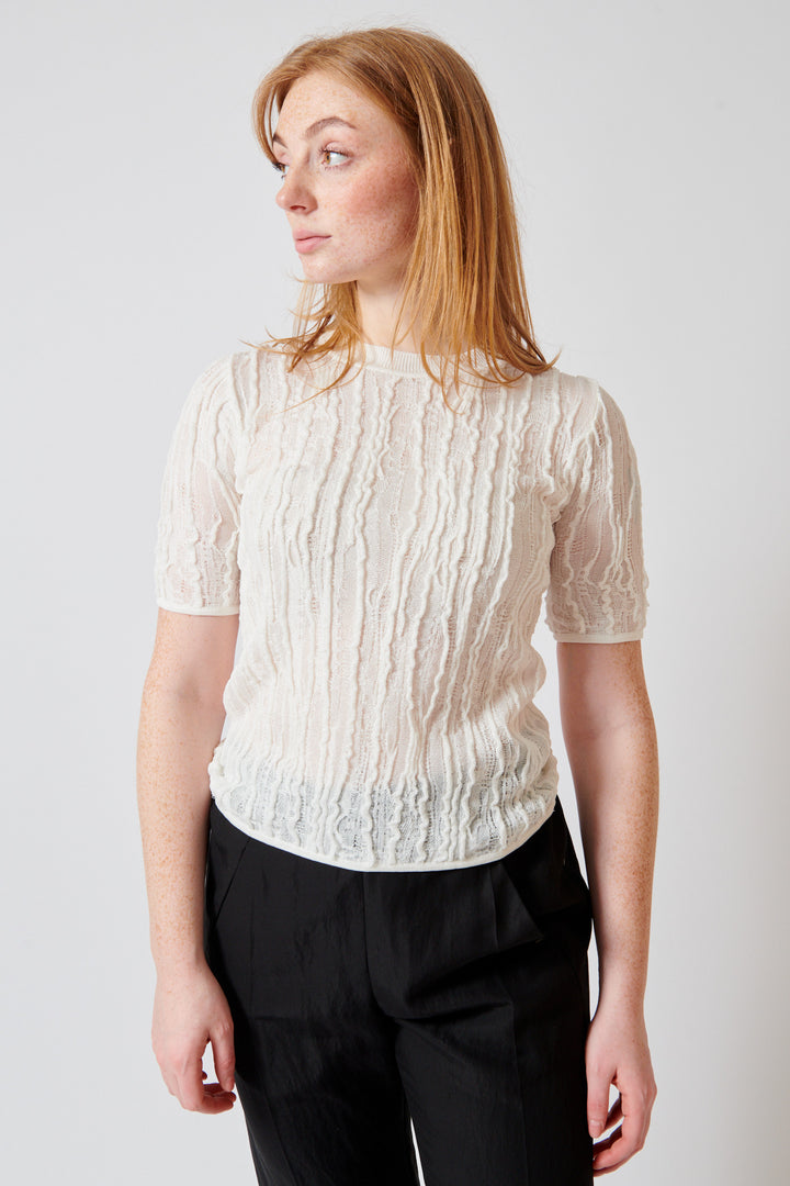Waverly wearing Christian Wijnants Kibo Knitted Top With Short Sleeves In Textured Stitch front view