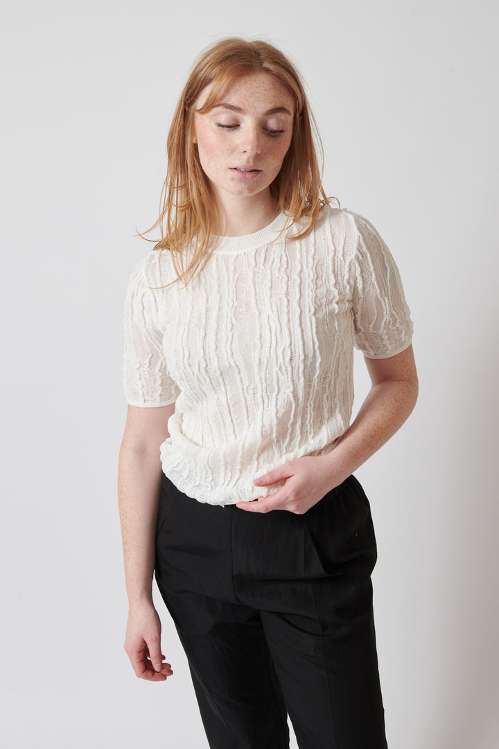 Waverly wearing Christian Wijnants Kibo Knitted Top With Short Sleeves In Textured Stitch front view