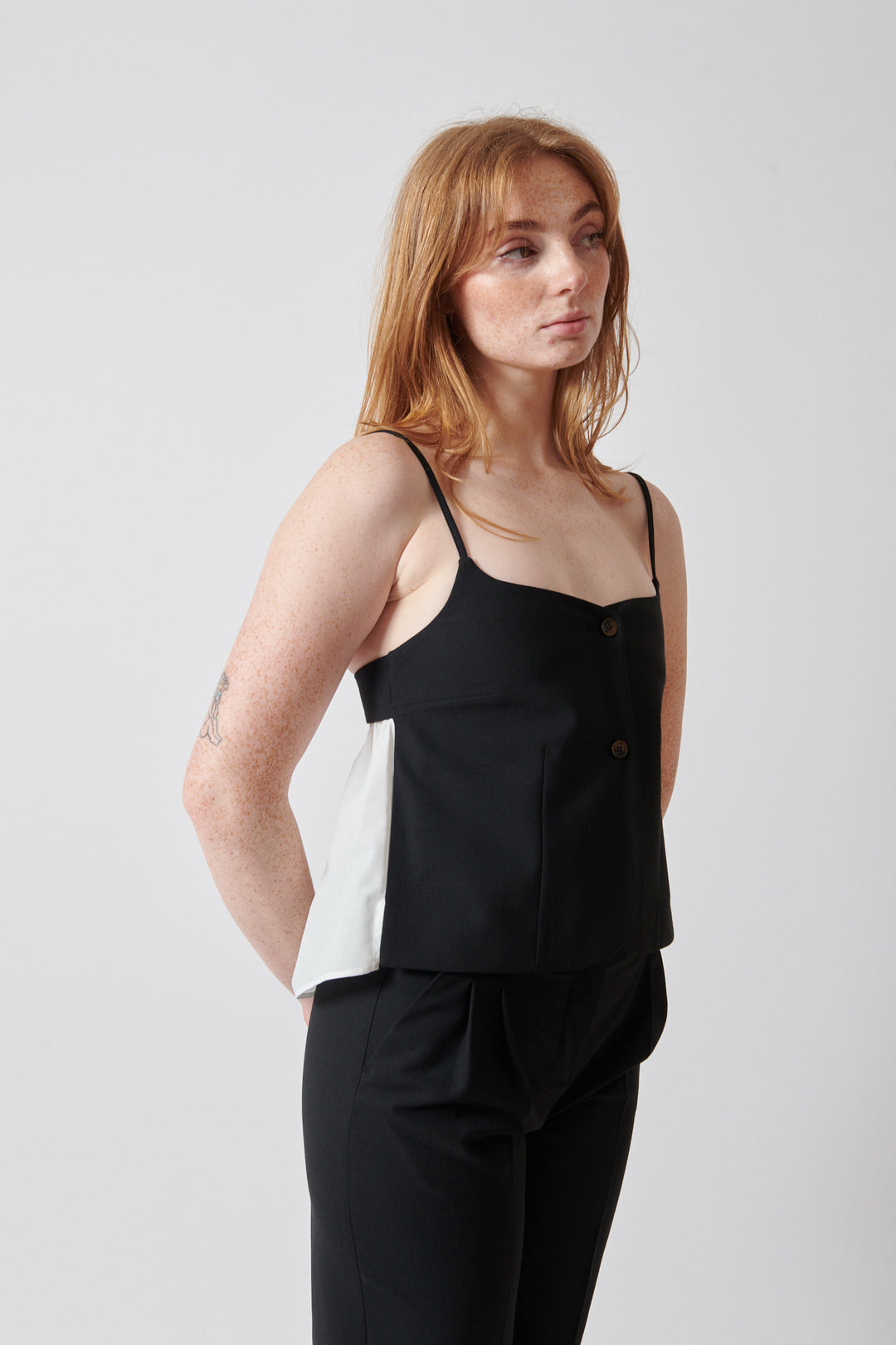 Waverly wearing The Garment Noah Tank Top front view