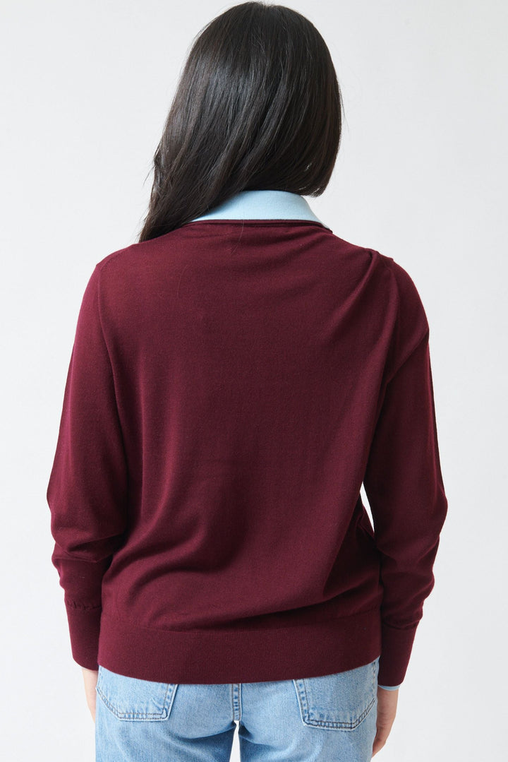Model wearing White + Warren Superfine Merino Layered Polo Black Cherry Light Blue Trim rear view
