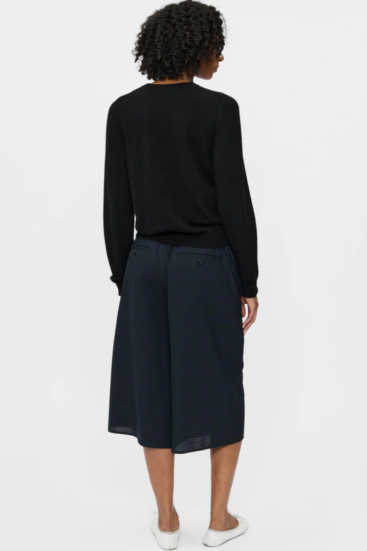 Model wearing 6397 Wrap Short Navy Tartan rear view 