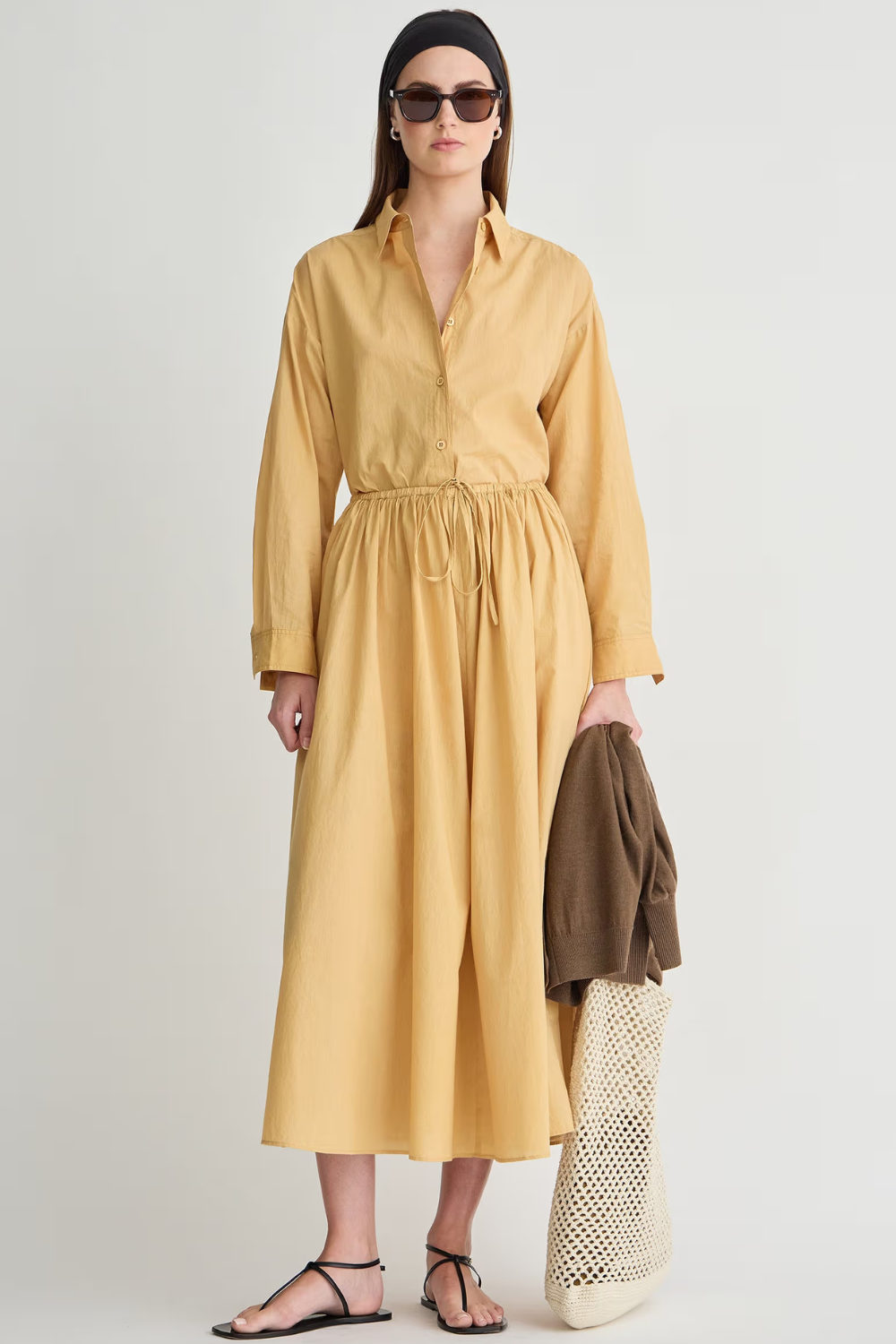 Model wearing Apiece Apart Priska Shirt Dress front view