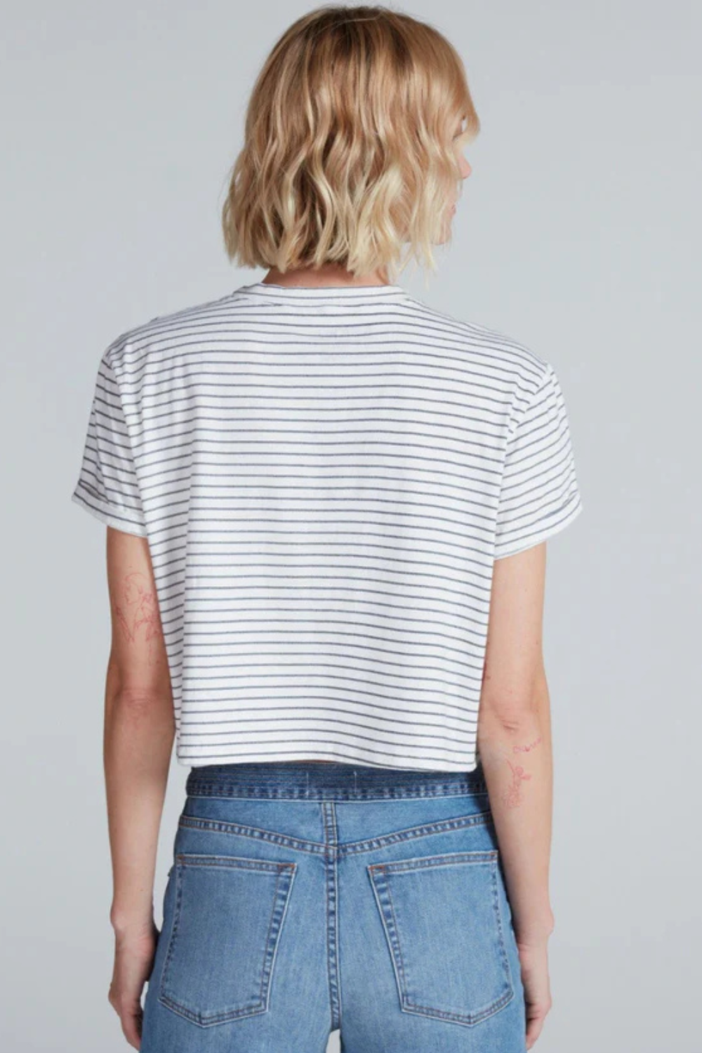 Model wearing ASKK NY Shrunken Boy Tee rear view