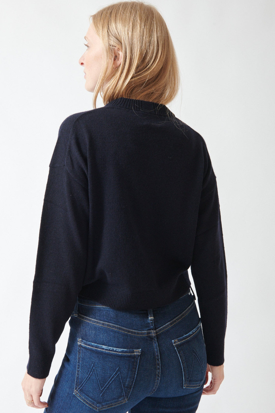 Madi wearing Allude Full Sleeve Inga Sweater Deep Night rear view