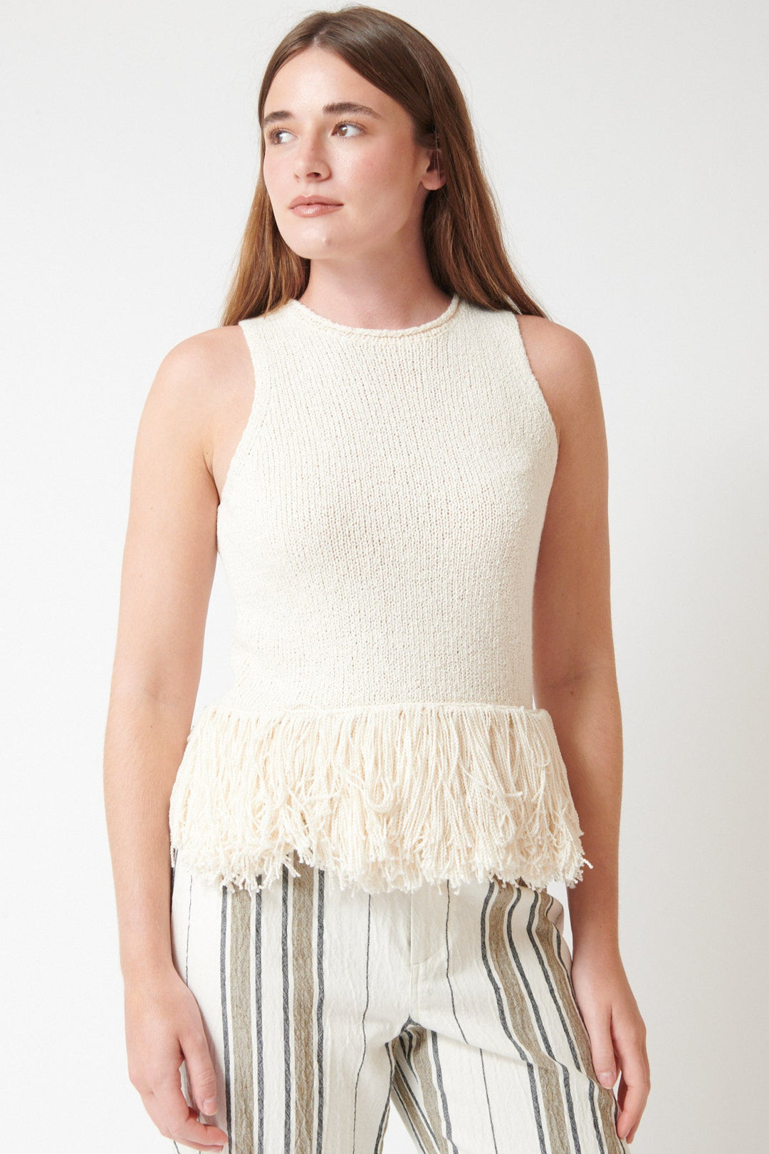 Julia wearing Apiece Apart Maeve Knit Fringe Tank front view