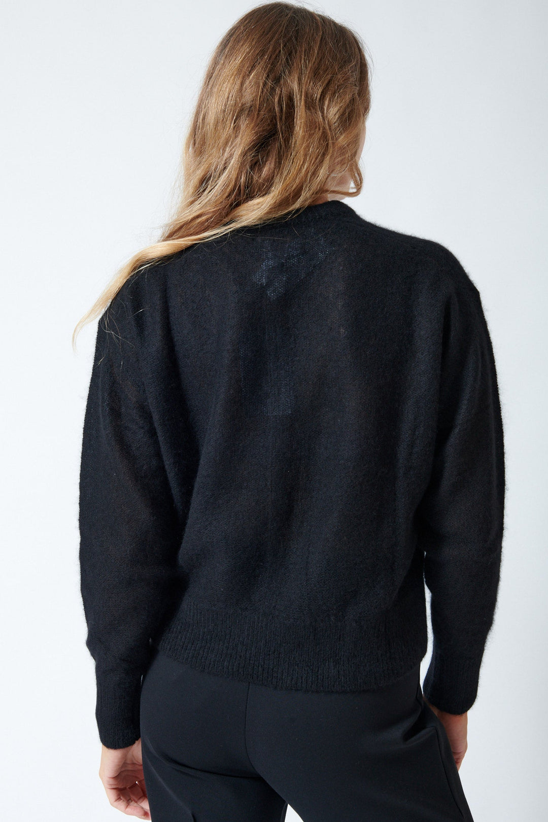 Mari wears sizing Apiece Apart Softest Tissue Weight Sweater rear view