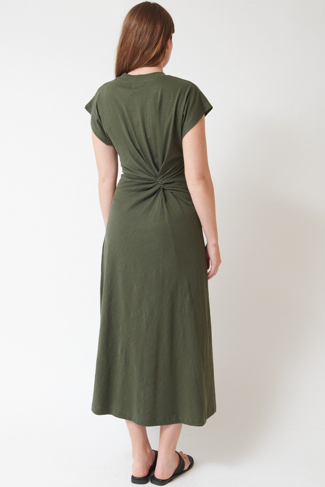 Julia wearing Apiece Apart Volta Twist Dress rear view