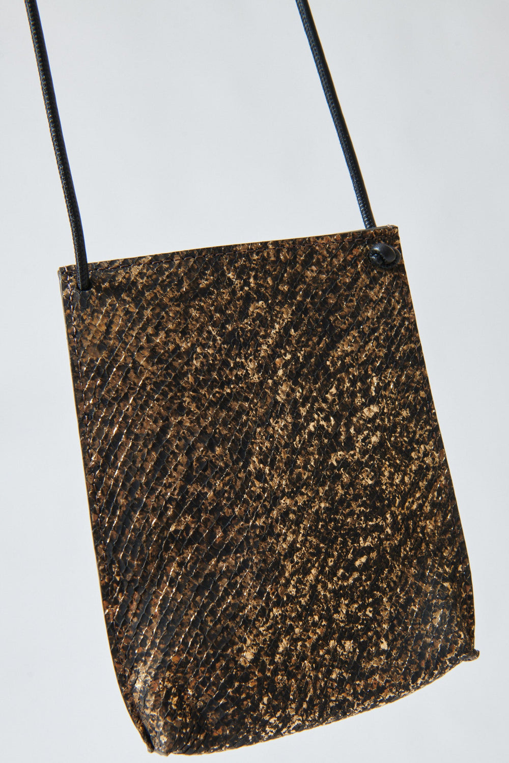 Model holding B.May Cell Pouch front view