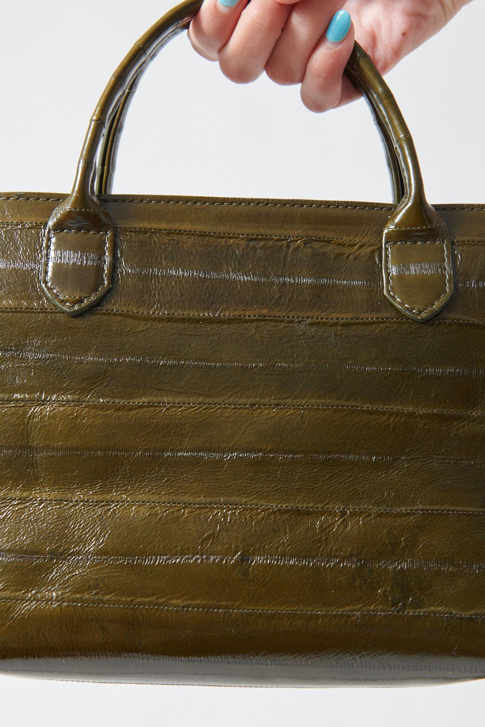 Model holding B.May Mini Day Bag front view