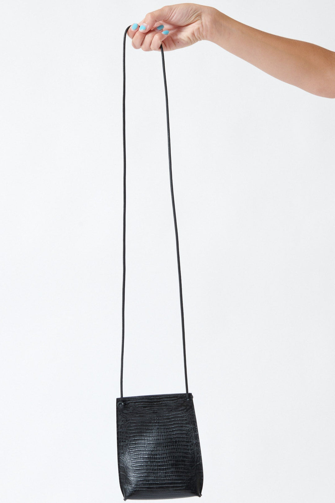 Model wearing B.May Cell Pouch front view