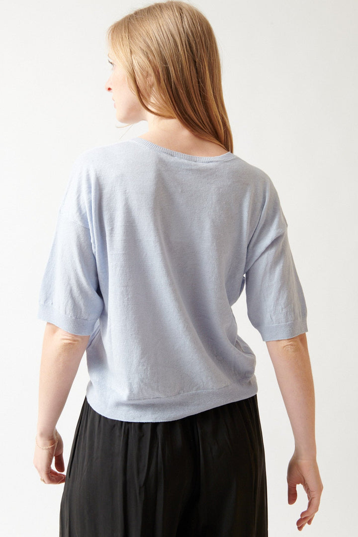 Madi wearing Base Linen Cotton Knit Split Neck Top rear view