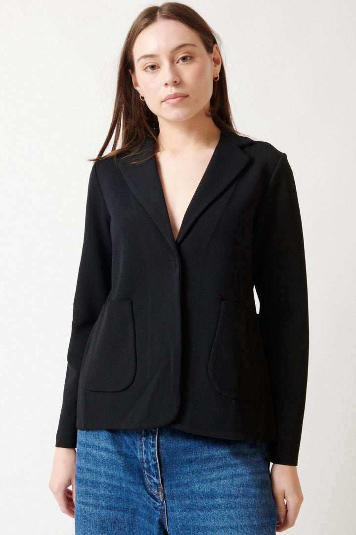 Angela wearing Base Single Snap Closure Knit Blazer Black front view