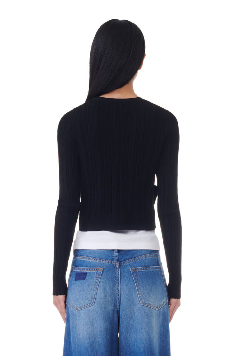 Model wearing Ganni Light Viscose Rib Cardigan rear view