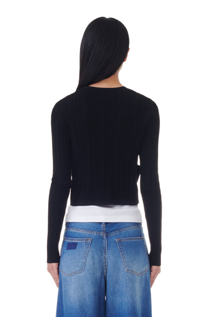 Model wearing Ganni Light Viscose Rib Cardigan rear view